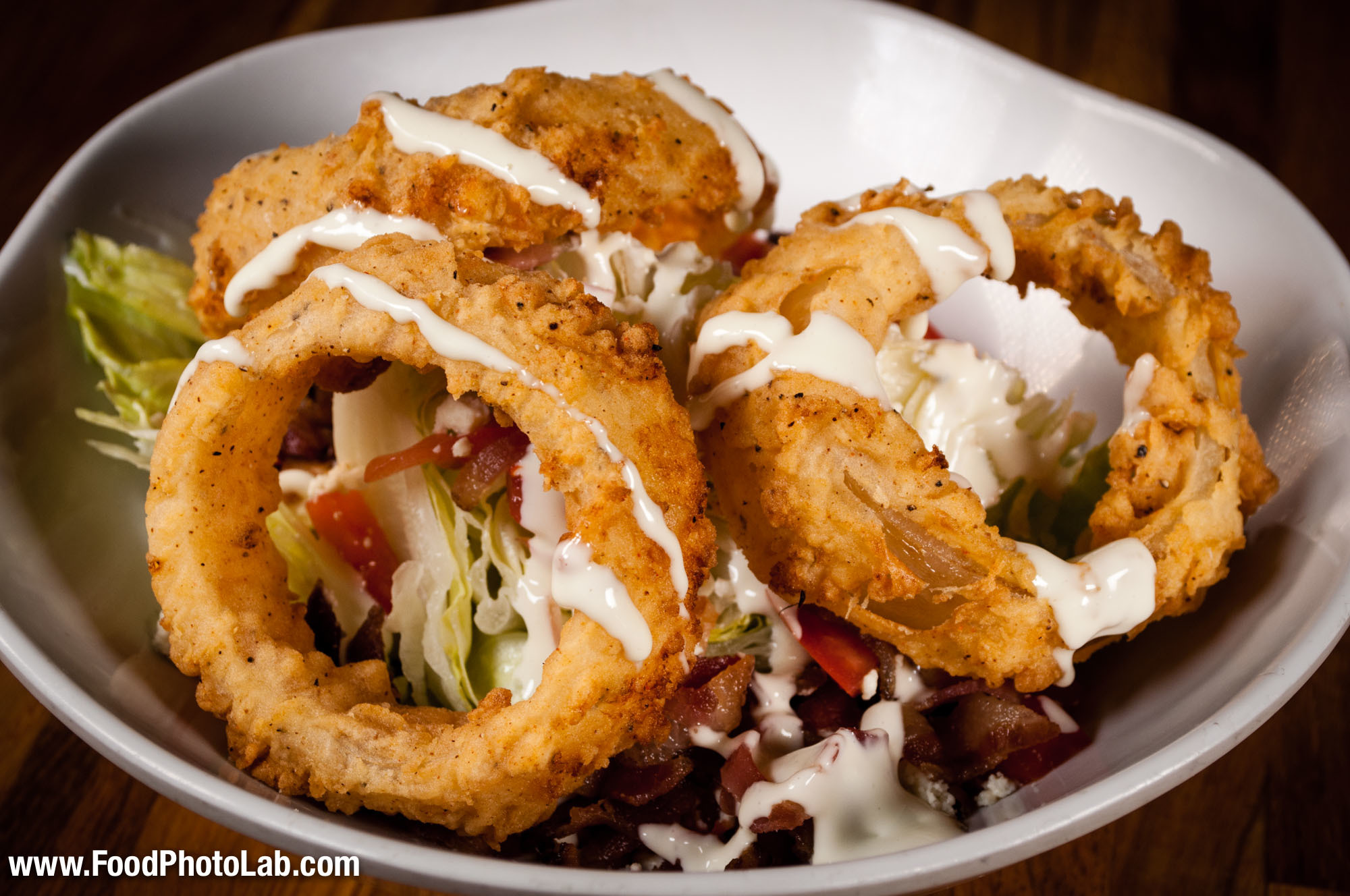czar salad  topped with onion rings
